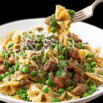 Sausage Pesto Pasta with Caramelized Onions and Peas